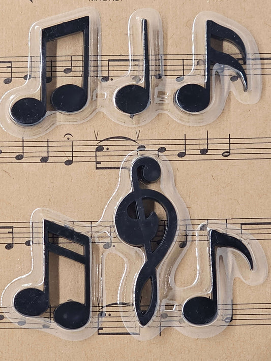 Transparent music note stamps on a sheet of music paper