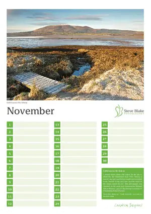 Calendar page for November with a scenic landscape of a mountain and water body.
