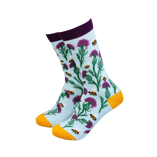 Thistle and Bee women's bamboo socks with vibrant floral patterns and bee prints, perfect for stylish comfort and sustainability.