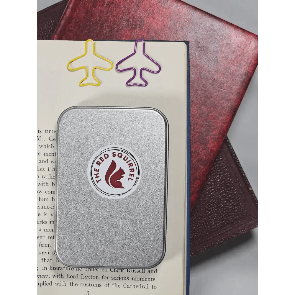 20 airplane shaped paper clips in a tin. - The Red Squirrel