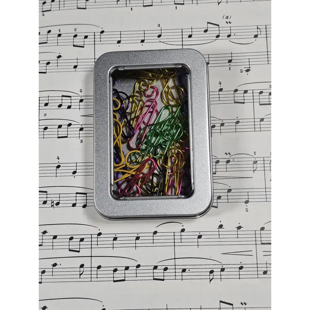 20 Treble Clef Musical note Paper clips in a tin. - paper clips