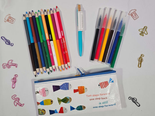 Colorful pencil case bundle with fine-tip pens, pencils, and a recycled pen on a white background.