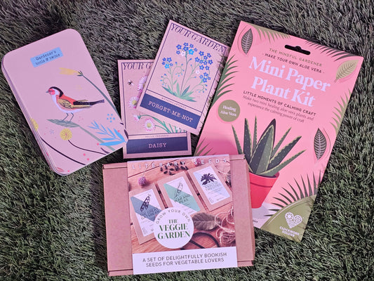 Green Fingered Gift Set featuring Mini Paper Plant Kit, Forget-me-not seeds, Daisy seeds, and gardening tools.
