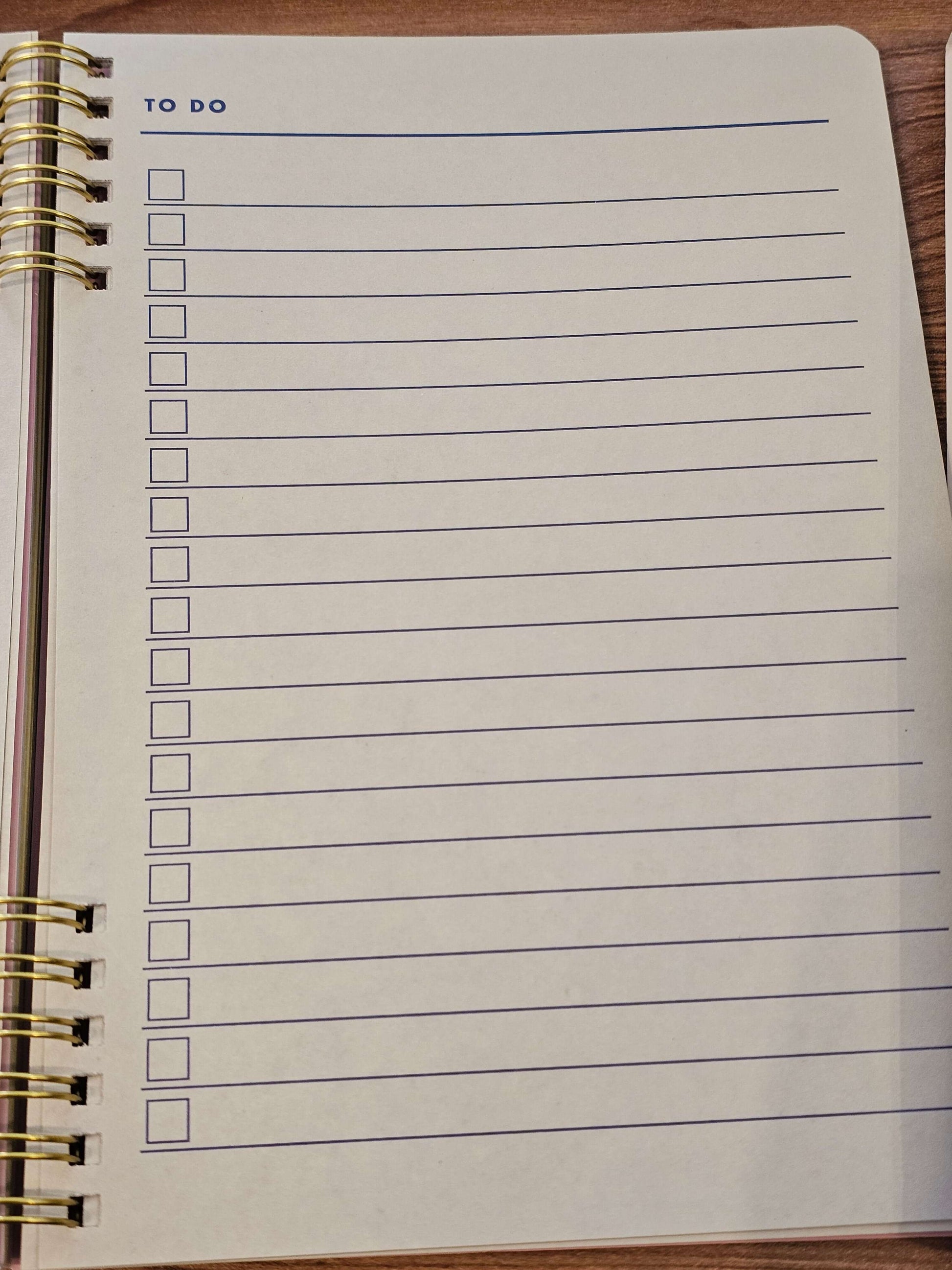 Empty to-do list page in spiral-bound notebook for goal tracking and habit organization.