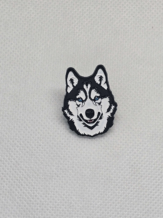 Black and white enamel pin badge featuring a cute Siberian Husky dog face design.