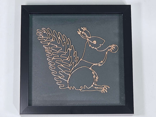 Framed Squirrel made from wire on a black background