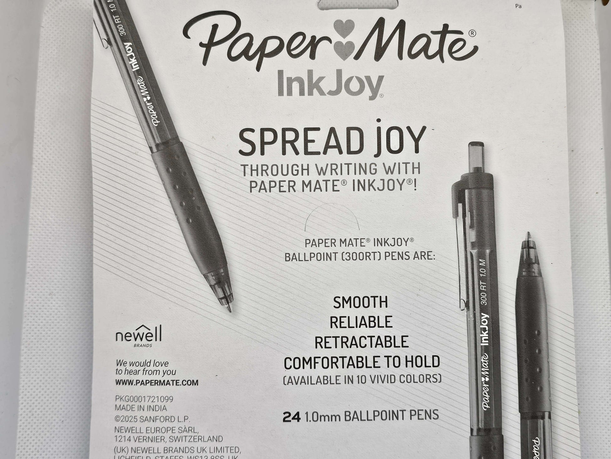 Advertisement for Paper Mate InkJoy pens with product packaging and branding.