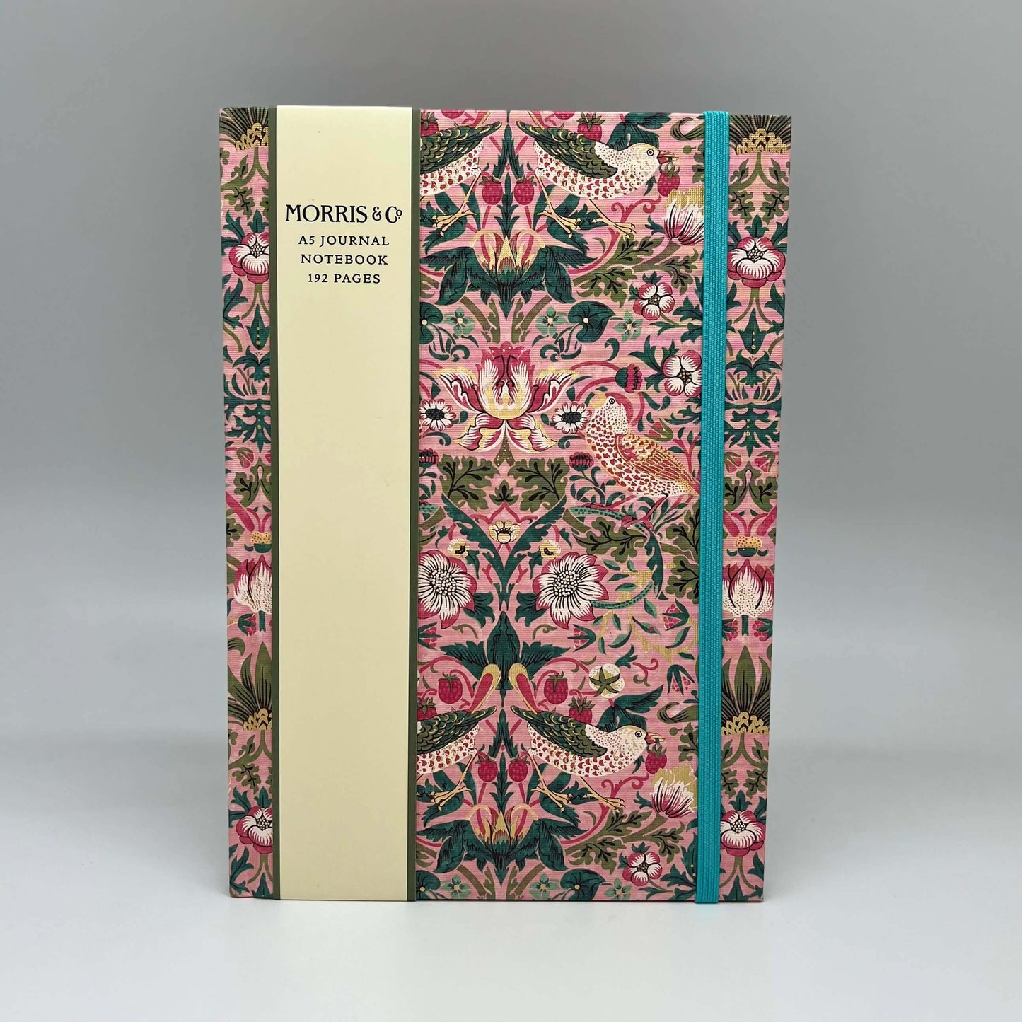 Notebook with decorative cover and Morris & Co branding on a gray background