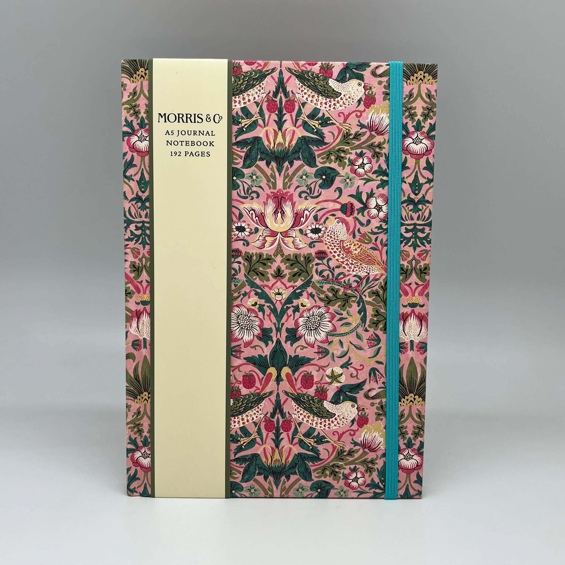 Notebook with decorative cover and Morris & Co branding on a gray background