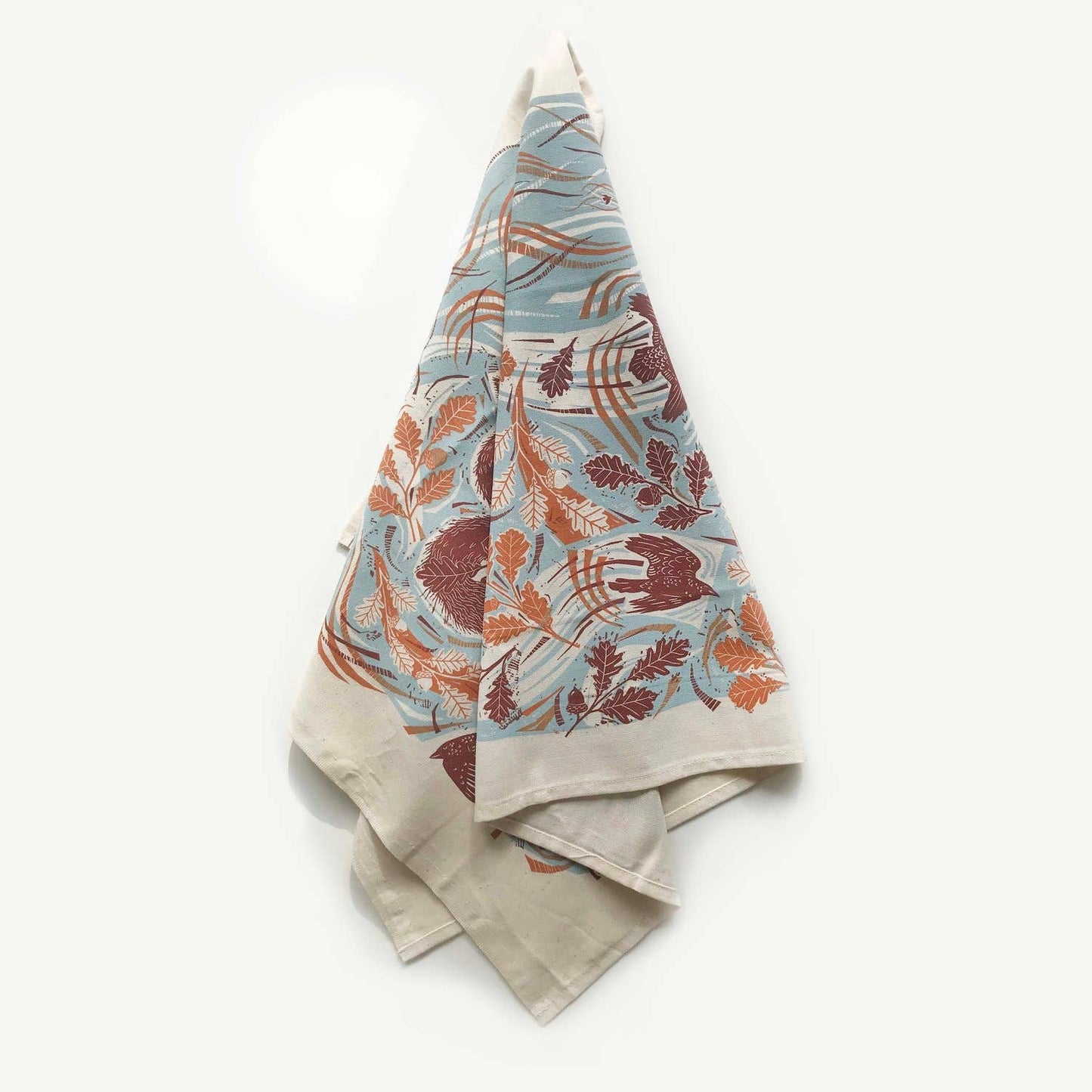Decorative towel with leaf pattern on a white background