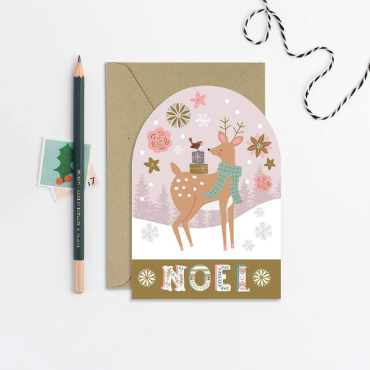 Christmas card with a deer illustration and 'Noel' text, featuring a pencil and envelope on a white background.