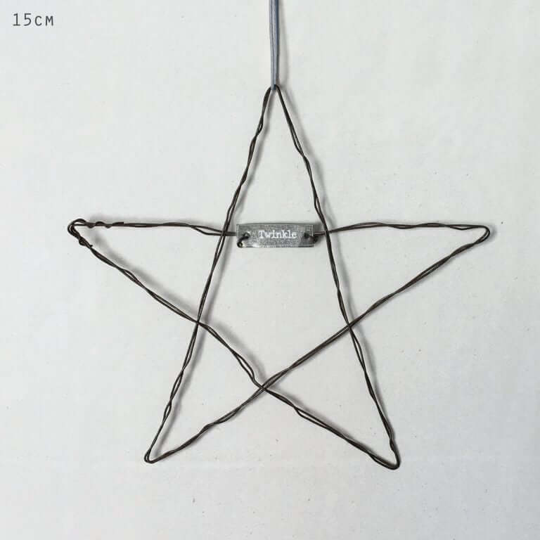 Star-shaped wire ornament with 'Twinkle' label on a white background