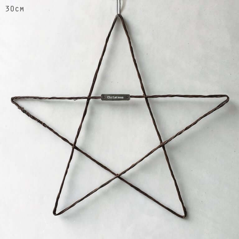 Wire star decoration with a label on a white background