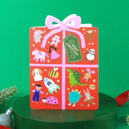 Children's book with cartoon characters on a red cover against a green background