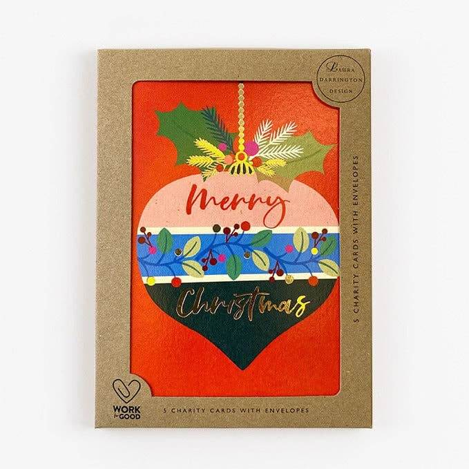 Packaging of Christmas cards with a decorative design on an orange background