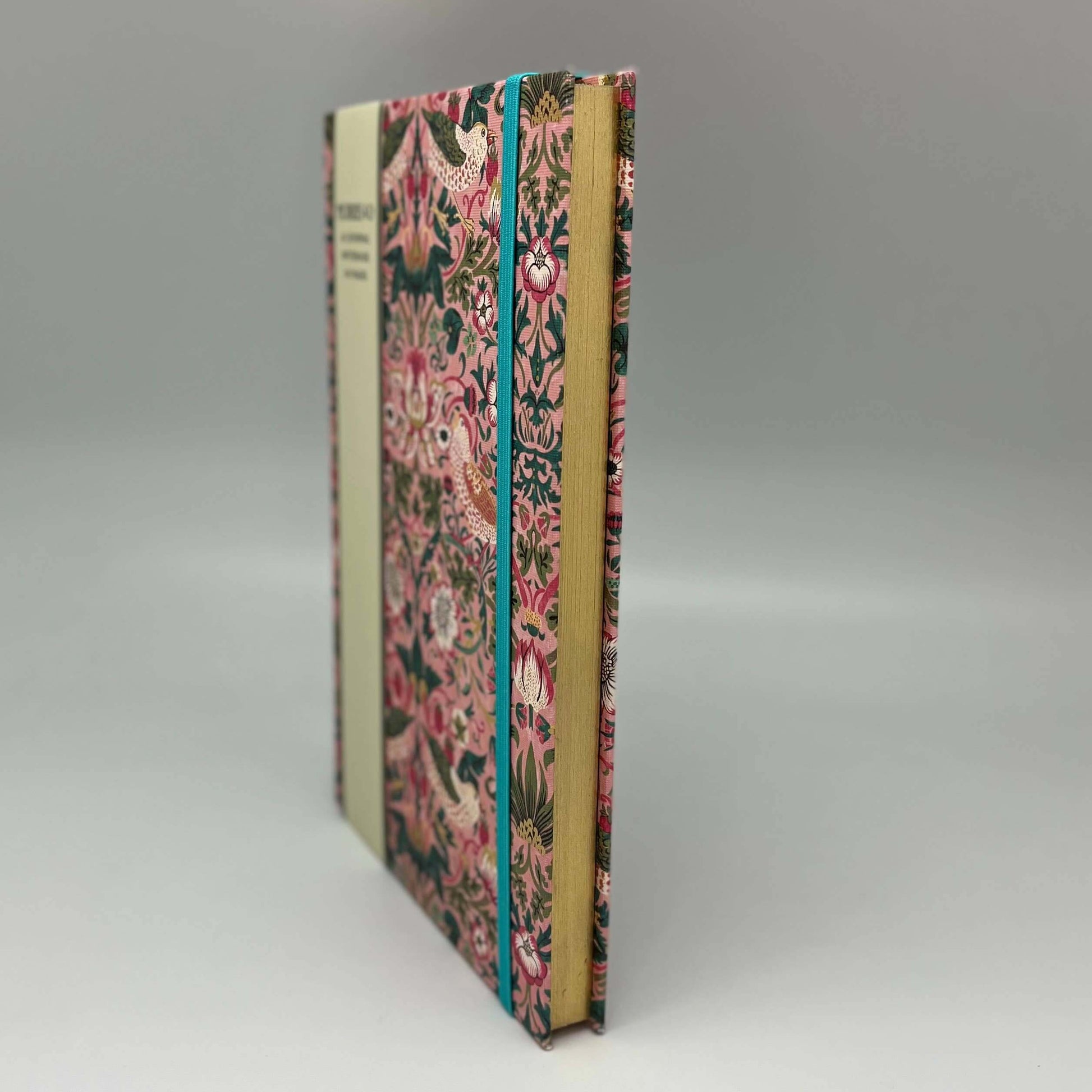 Book with floral design on a gray background
