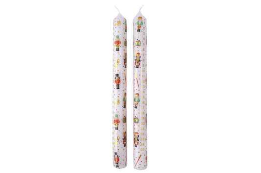 Two white candles with colorful designs on a white background
