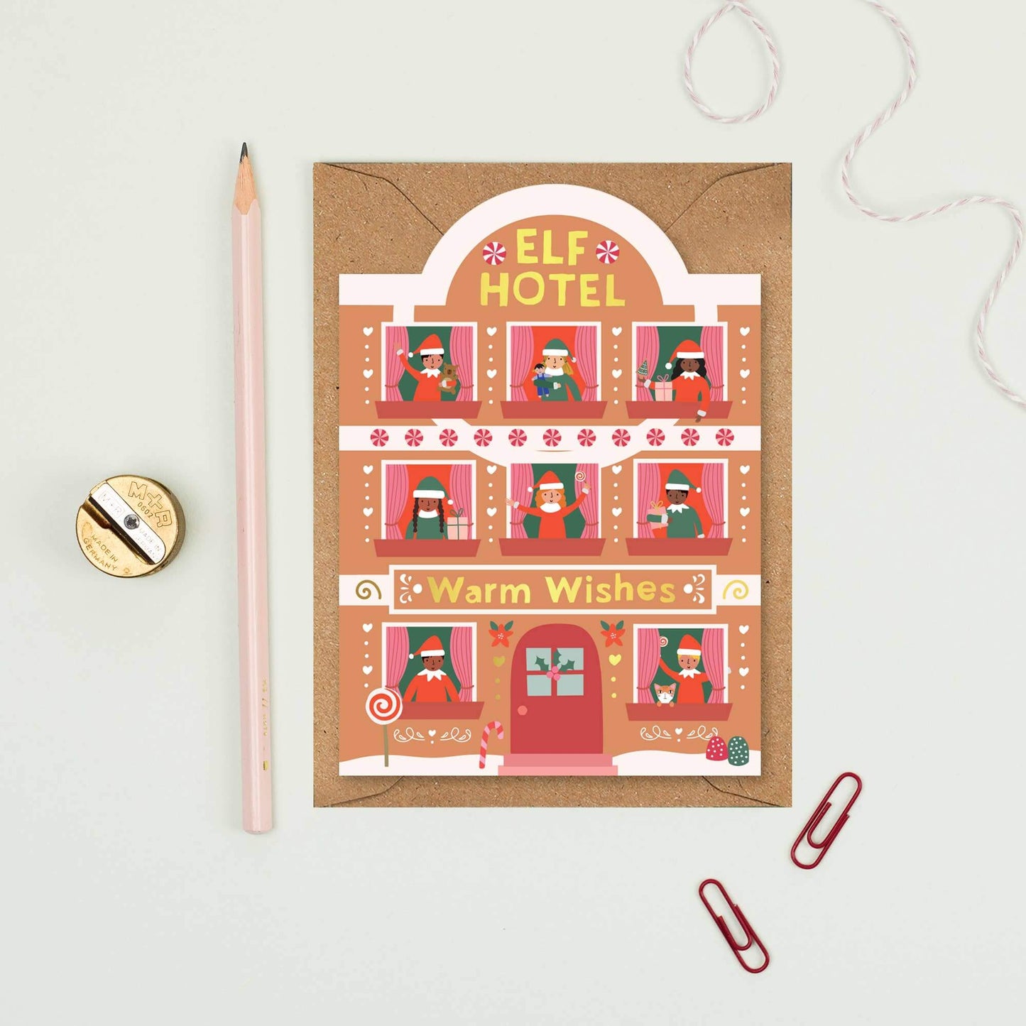 Christmas card with 'Elf Hotel' design on a light gray background
