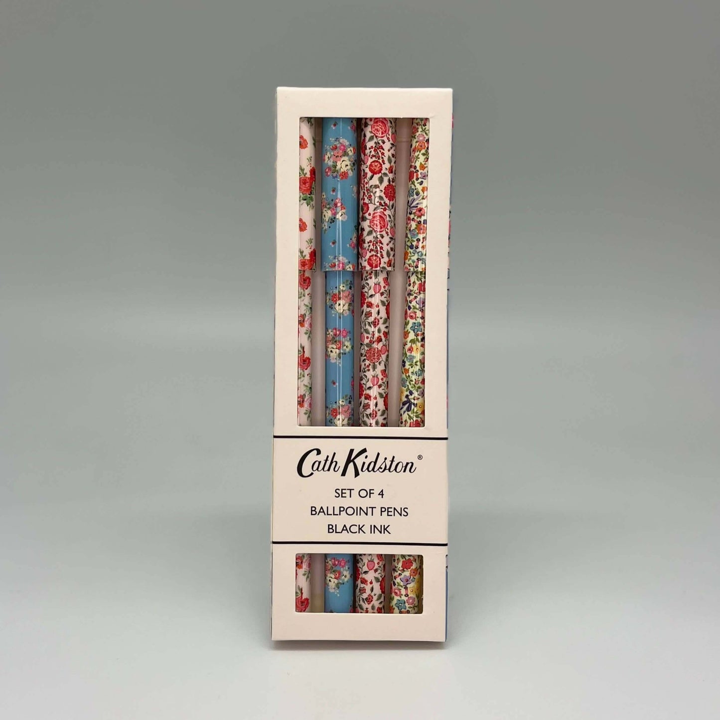 Set of 4 ballpoint pens in floral packaging with Cath Kidston branding on a gray background
