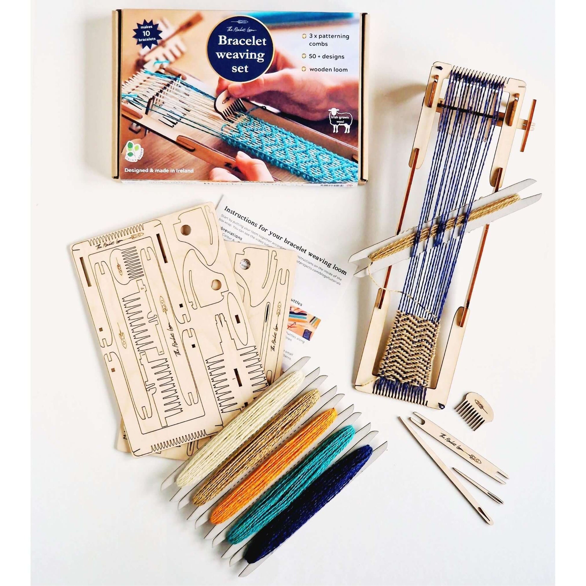Colorful bracelet weaving kit with wooden loom, yarn, and patterning combs for creative projects.