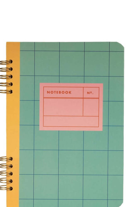 Spiral bound A5 notebook in teal and yellow with a colorful grid design and a label for notes.