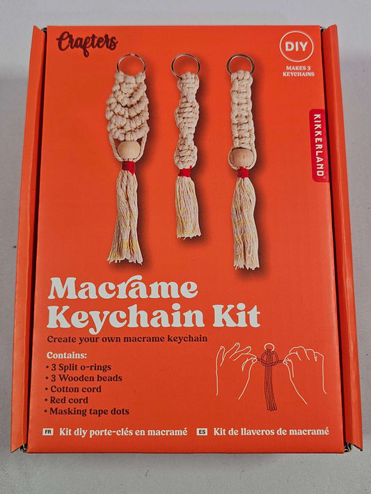 DIY Macrame Keychain Kit by Kikkerland, includes supplies for three unique keyrings with cotton cord and wooden beads.