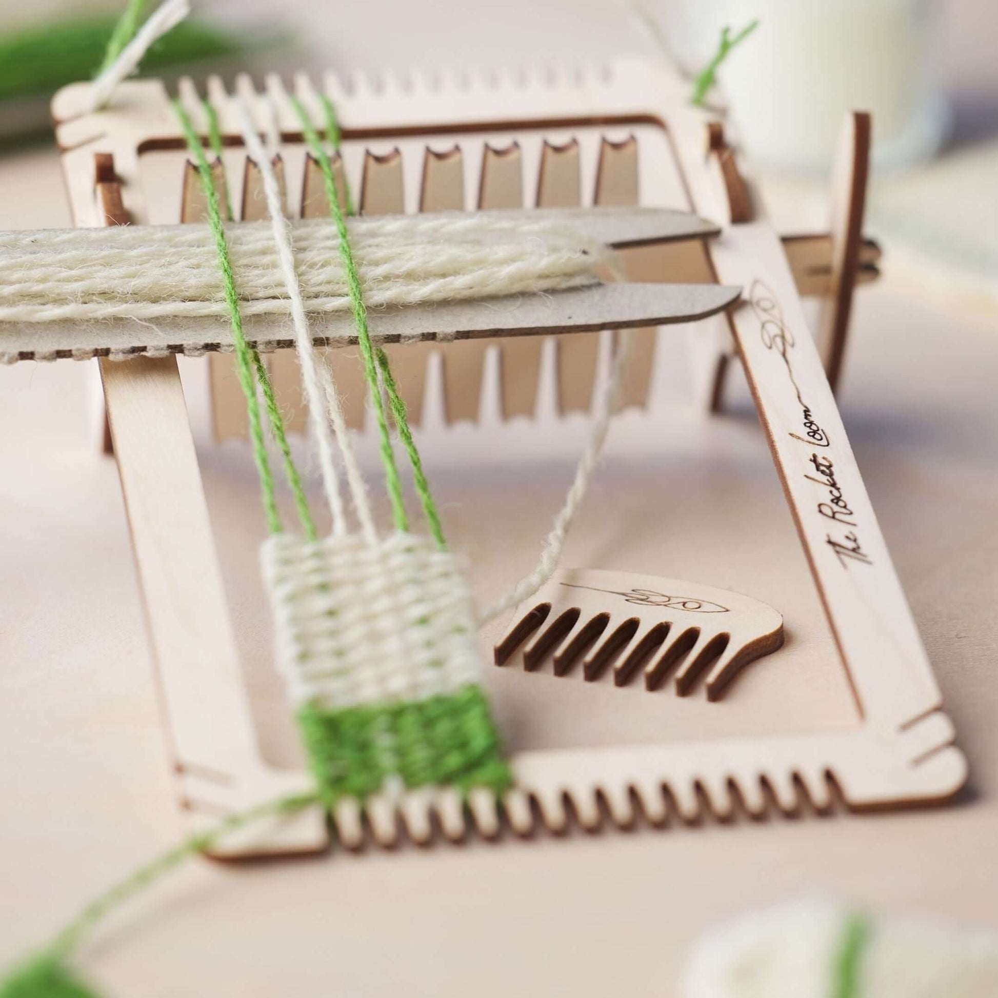 Mini loom weaving kit with Galway wool yarn, showcasing the Rocket Loom and colorful threads for creative projects.