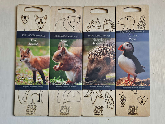Four wooden model animal kits featuring a fox, squirrel, hedgehog, and puffin, designed for creative building and decoration.