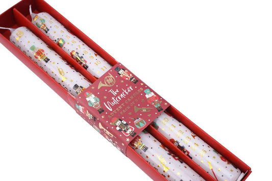 Decorative candles with festive design in a red box