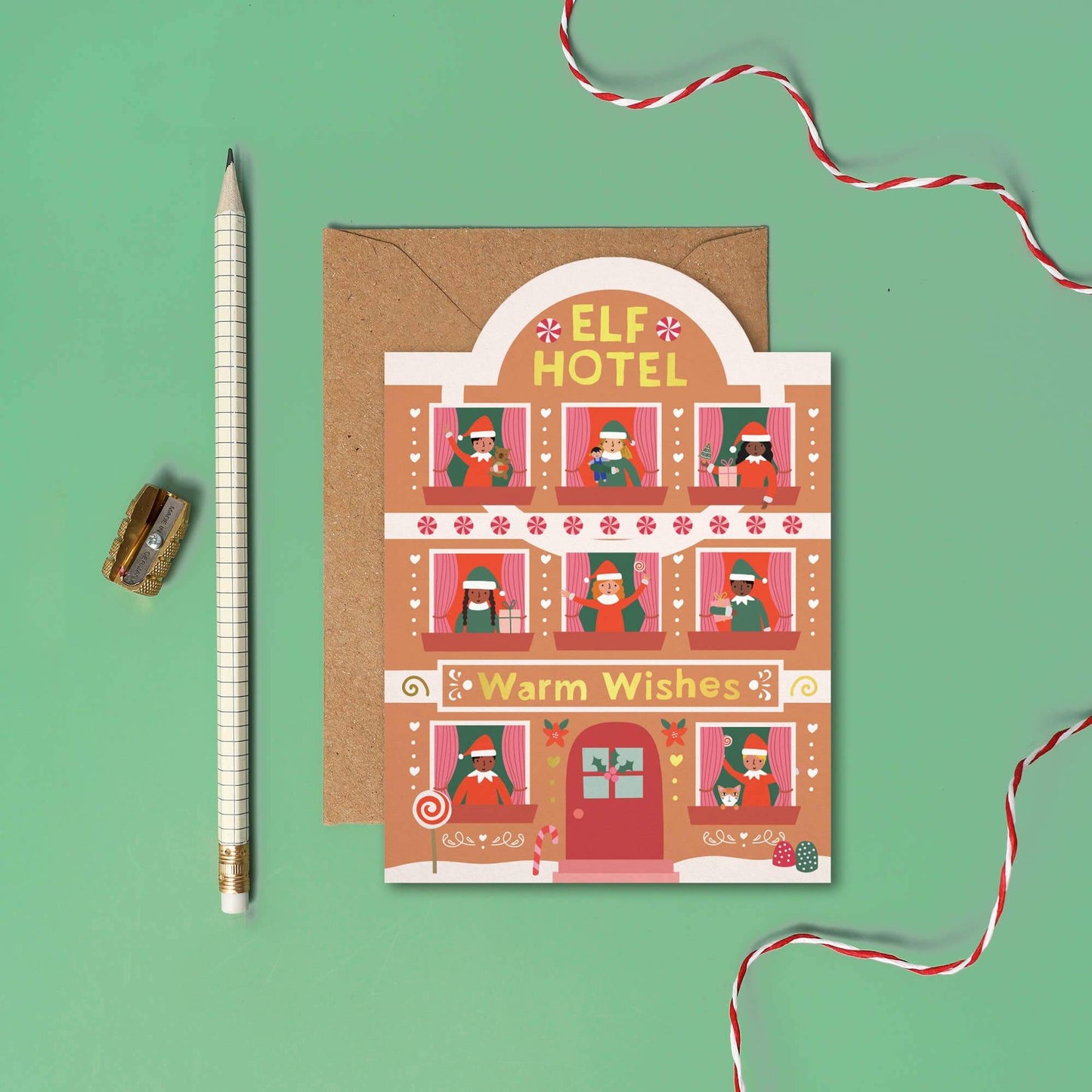 Greeting card with 'Elf Hotel' design on a green background