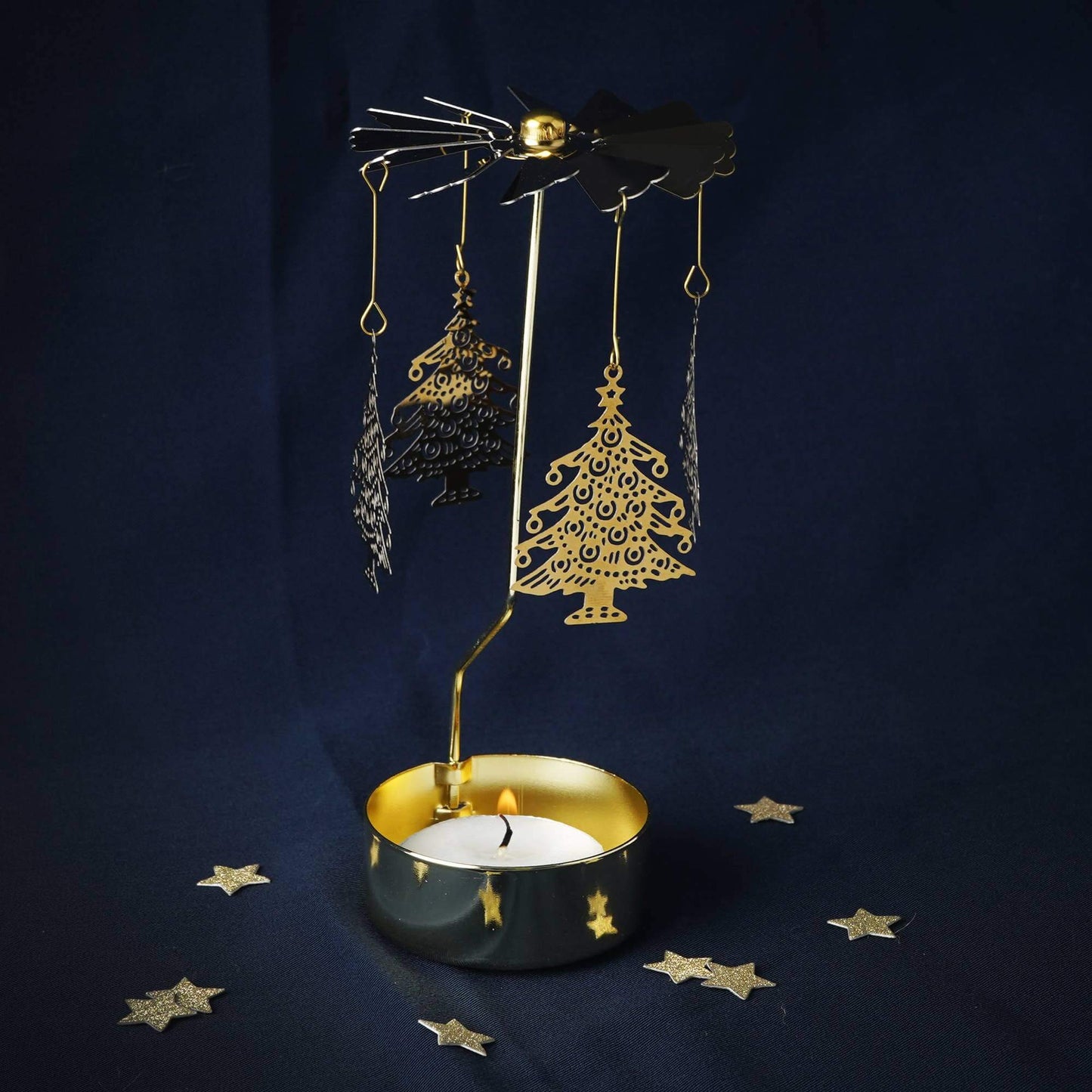 Decorative metal lamp with hanging ornaments on a dark blue background