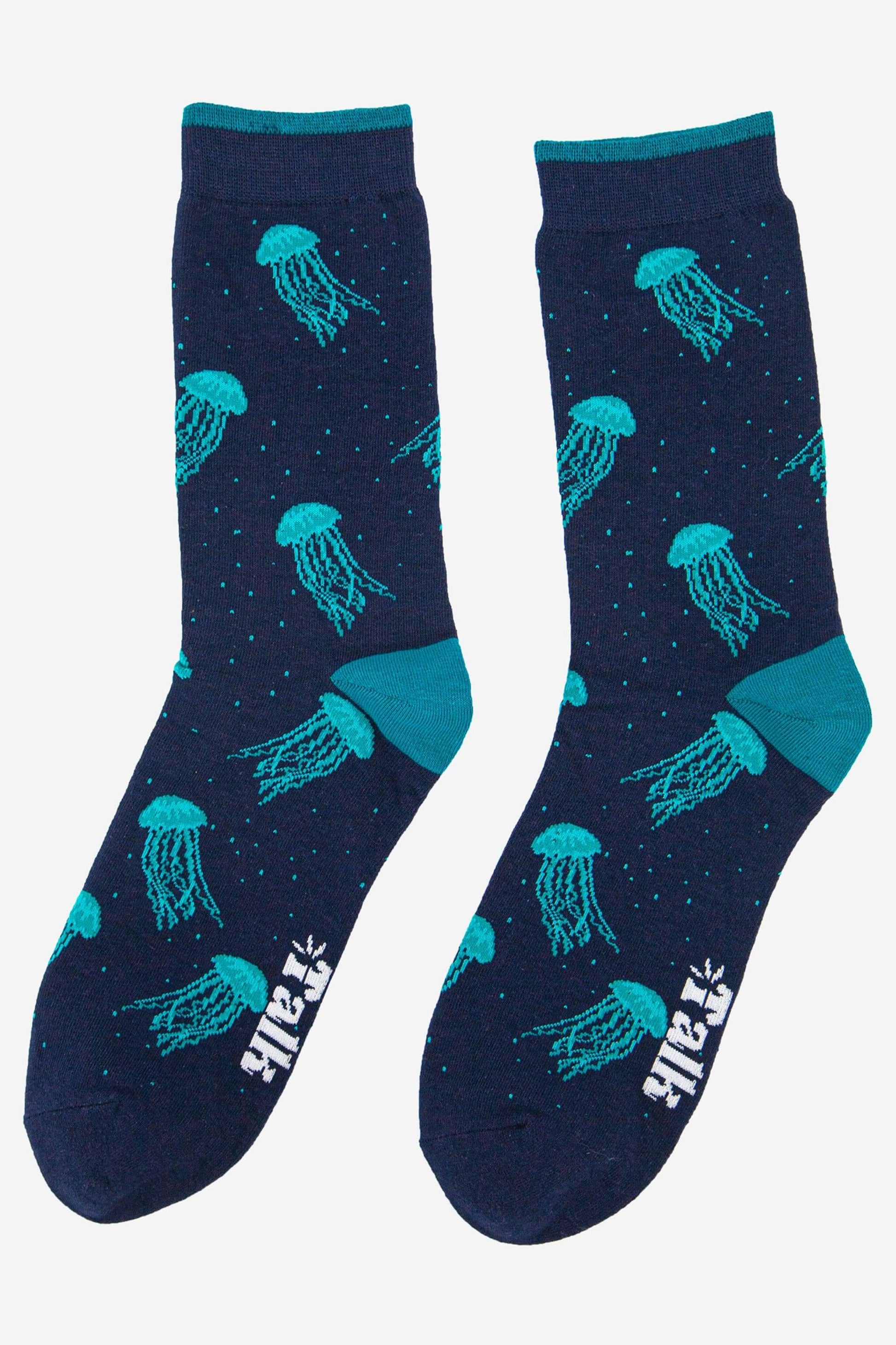 Navy blue socks with teal jellyfish pattern on a white background