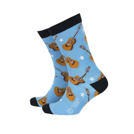 Men's bamboo socks featuring acoustic guitars and a blue background, combining comfort and funky style.
