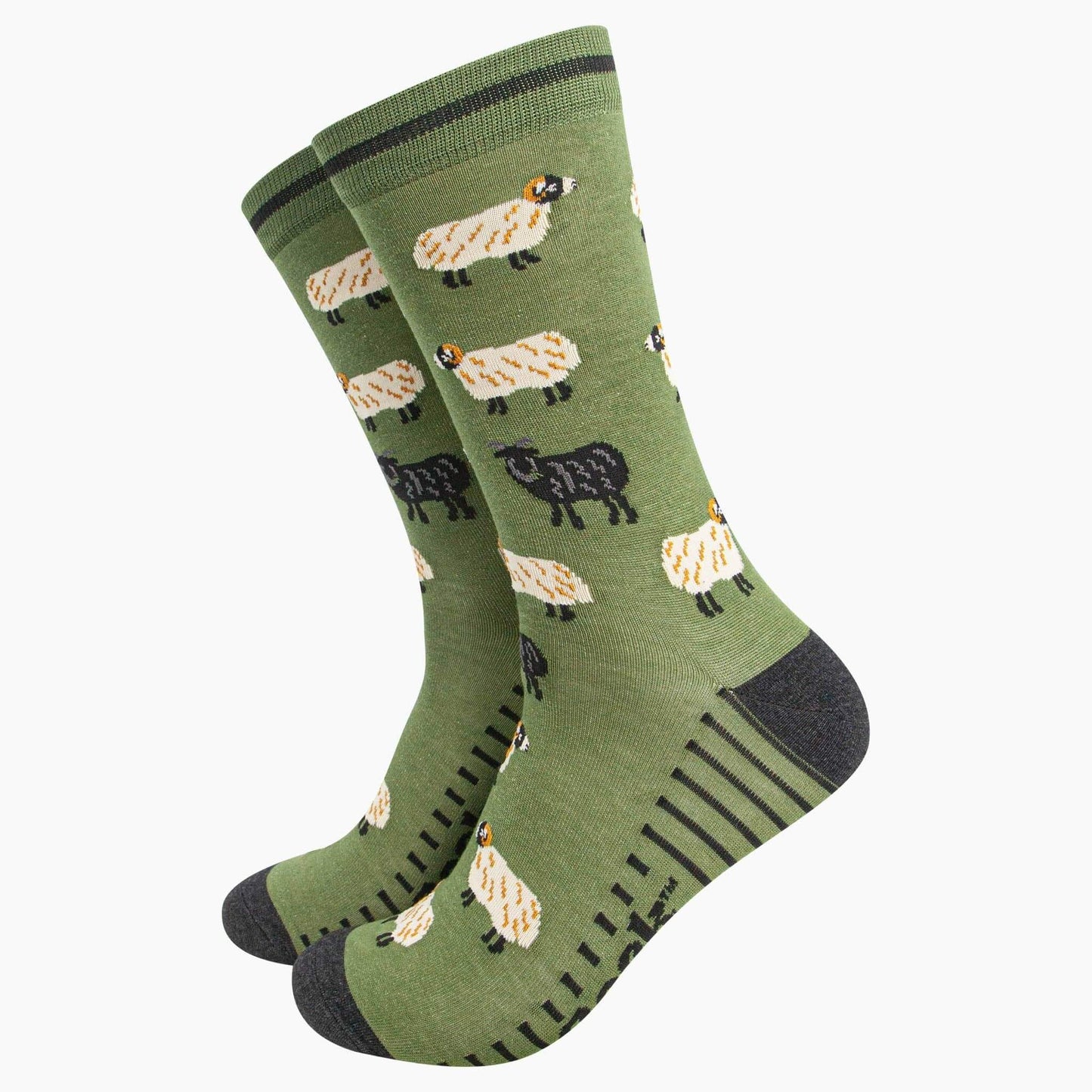 Green socks with sheep pattern on a white background