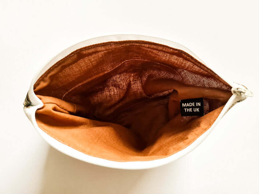 Brown fabric in a white container with 'Made in the UK' label on a white background