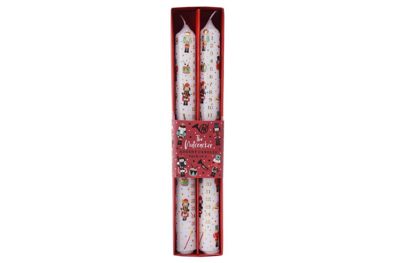Set of candles in a decorative box with Christmas-themed designs on a white background