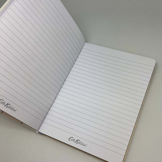 Open notebook with lined pages on a light gray background