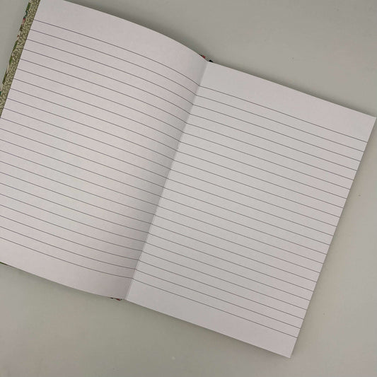 Open notebook with lined pages on a plain background