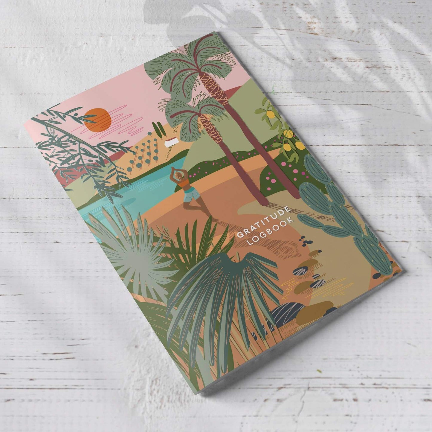 Gratitude Logbook A5 with yoga cover design featuring nature, calm colors, and tropical illustrations.