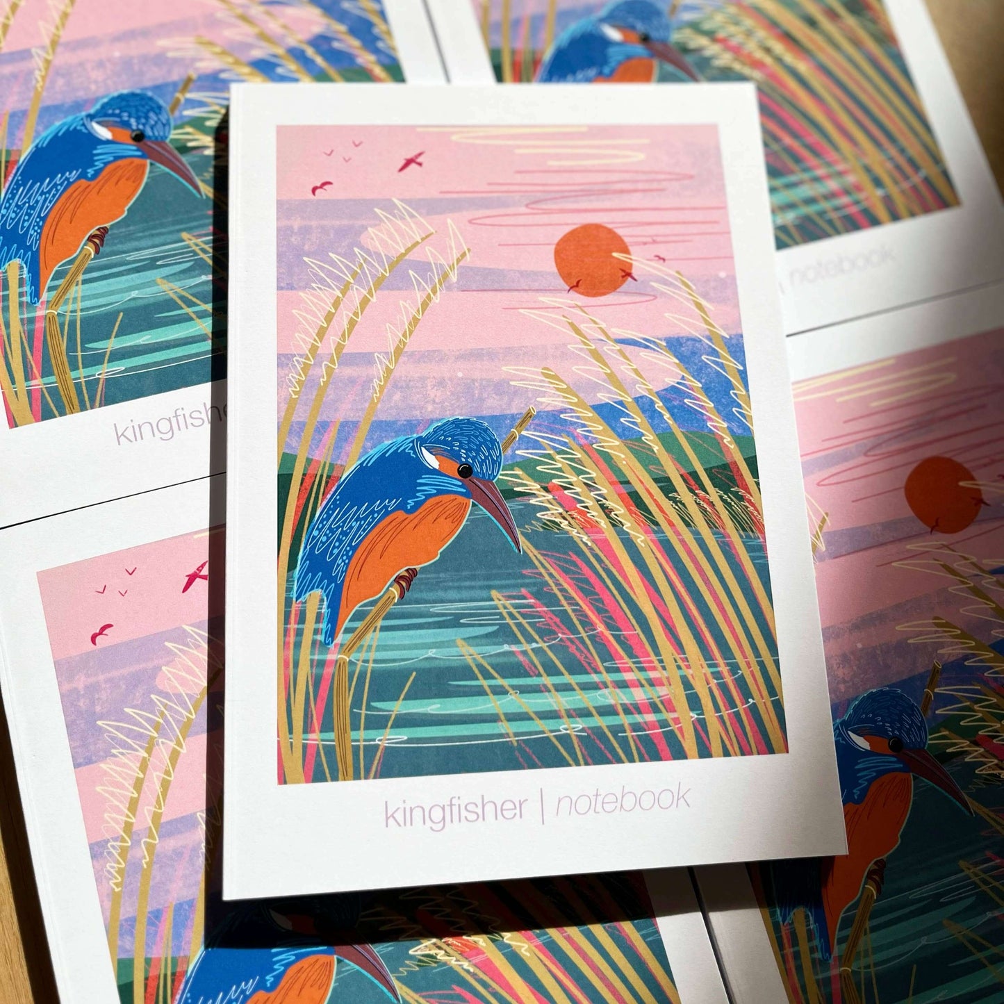 A5 Kingfisher notebook with colorful cover illustration and river scene, perfect for writing and sketches.