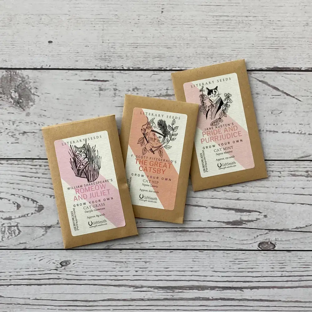 Three seed packets from Literary Seeds: The Cat Lover's Garden featuring Cat Mint, Cat Nip, and Cat Grass.