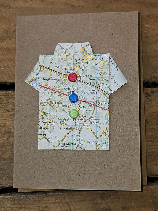 Handmade card with shirt design made from a map, featuring colorful buttons, unique and quirky design.