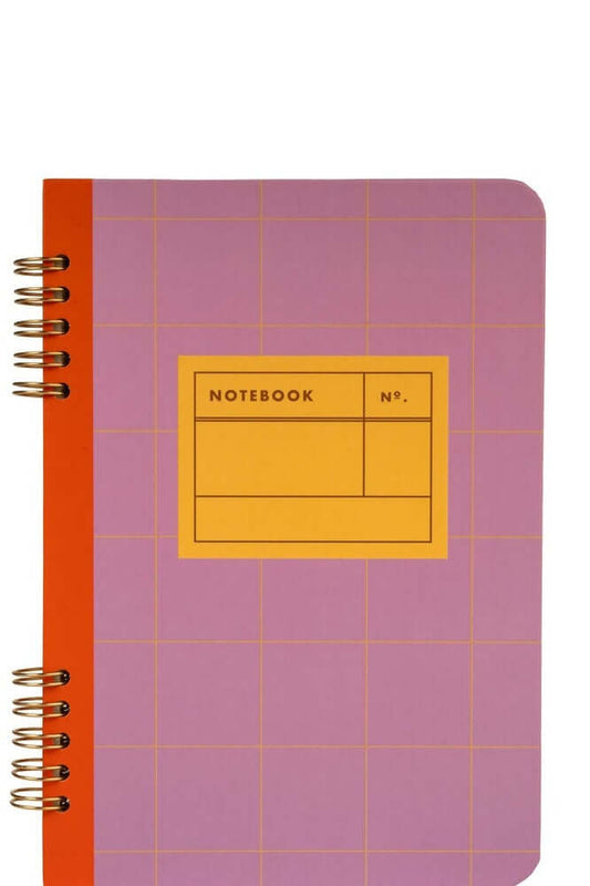 Spiral bound A5 notebook by Kikkerland in vibrant purple with orange accents and a grid design, ideal for stationery lovers.