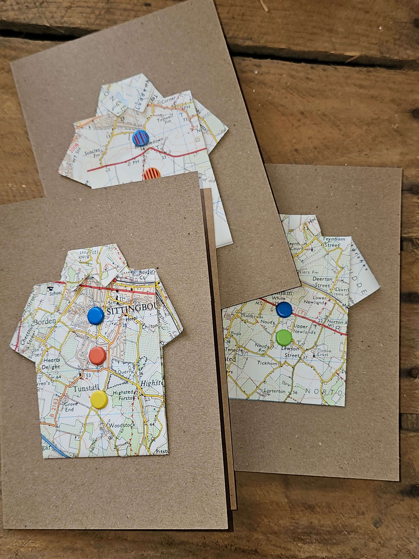 Unique map shirt greetings cards with colorful buttons, handmade from pre-loved maps by The Red Squirrel.