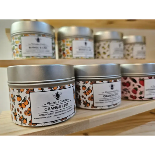 Scented candles from The Victorian Candle Co., showcasing Orange Zest, handcrafted in small batches in Carlisle.