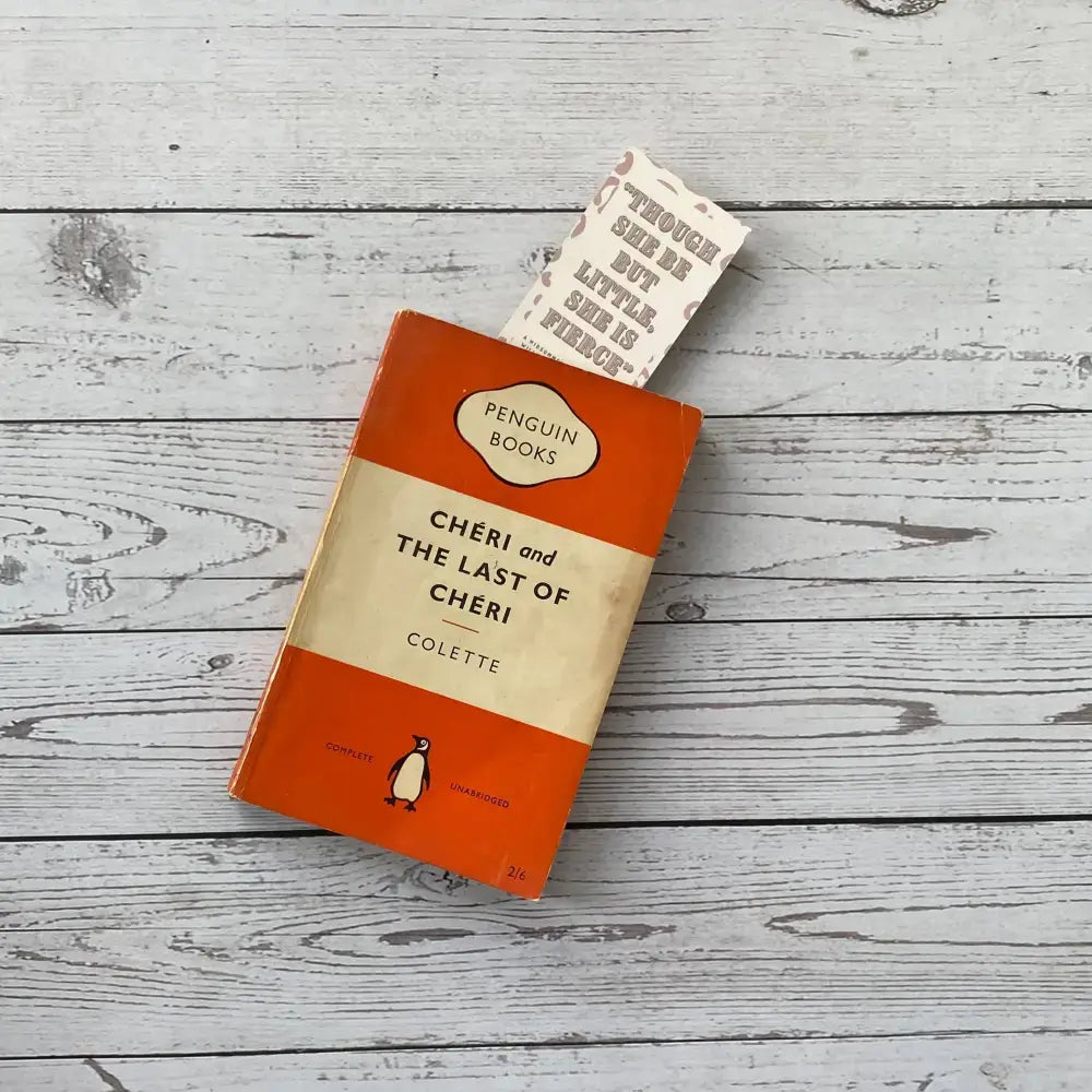 Velvet laminated bookmark featuring a classic literary quote, placed in a Penguin Books edition of 'Cheri and the Last of Cheri'.