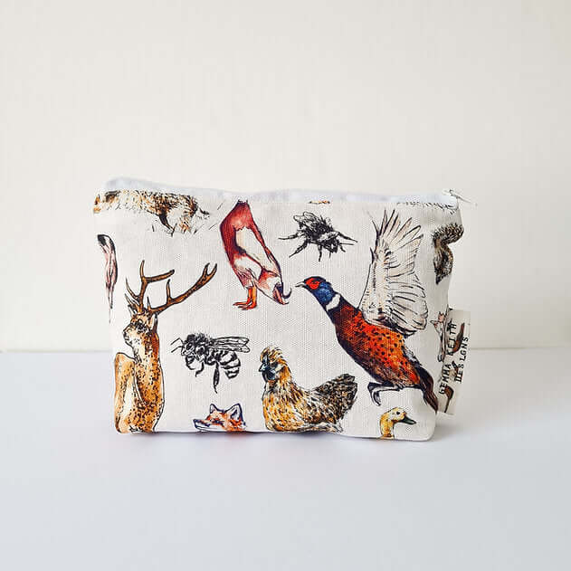 Fabric pouch with nature-themed design featuring animals on a white background