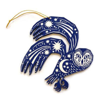 A wooden blue owl wall hanging