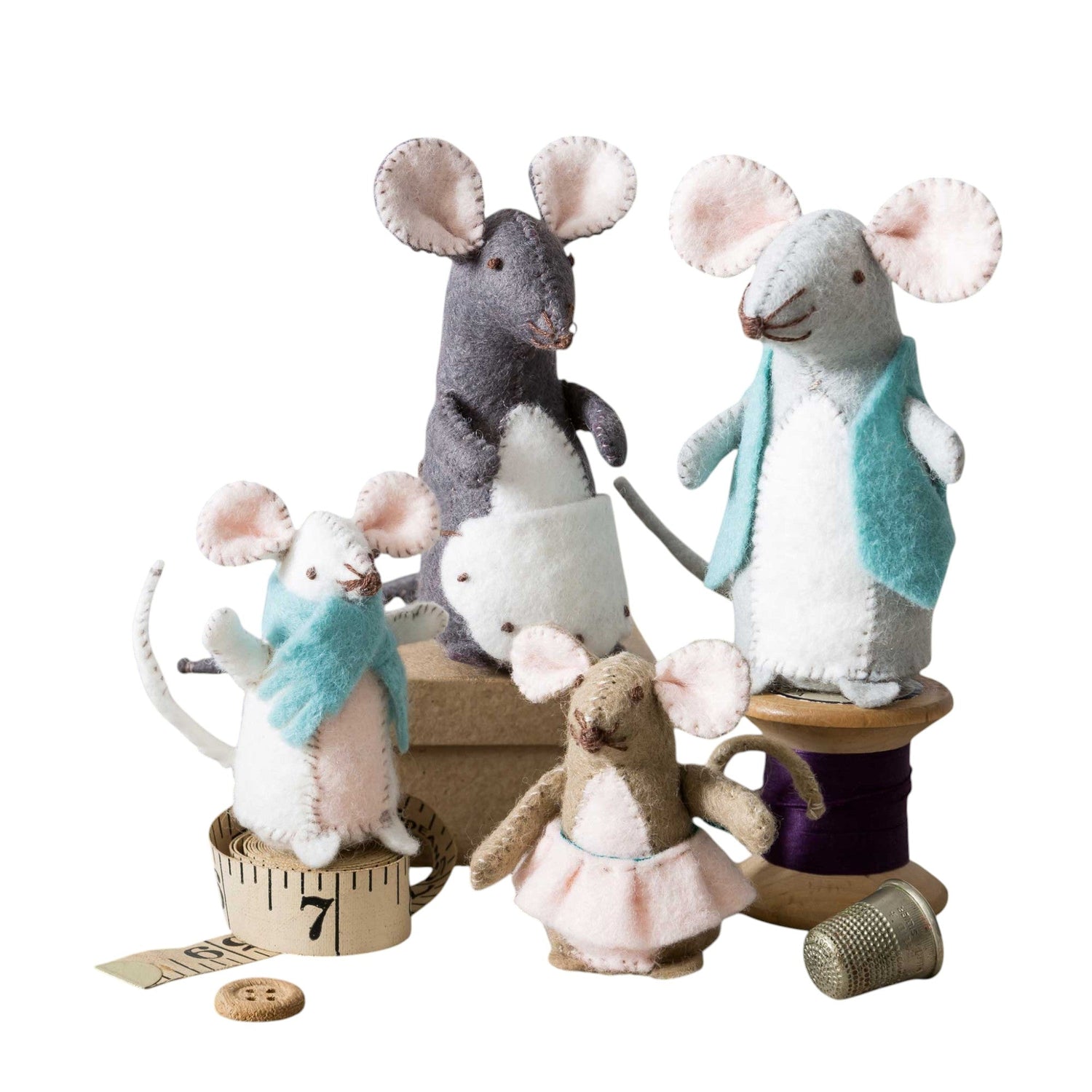 Felted rabbit holding a star and stick, wearing a blue scarf, surrounded by flowers and a button moon.