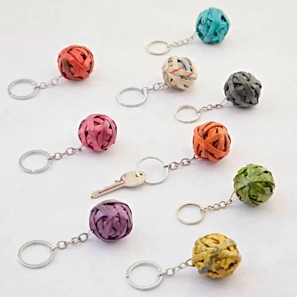 Colorful keychains shaped like decorative balls in a variety of colors, perfect for adding flair to your accessories collection.